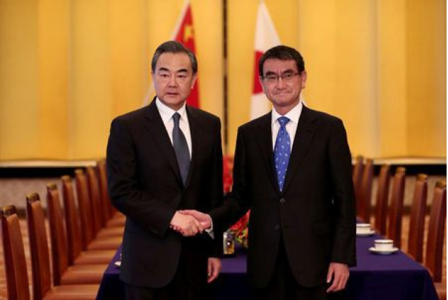 Japan and China’s Foreign  Ministers Pledge To Pursue Improved Ties